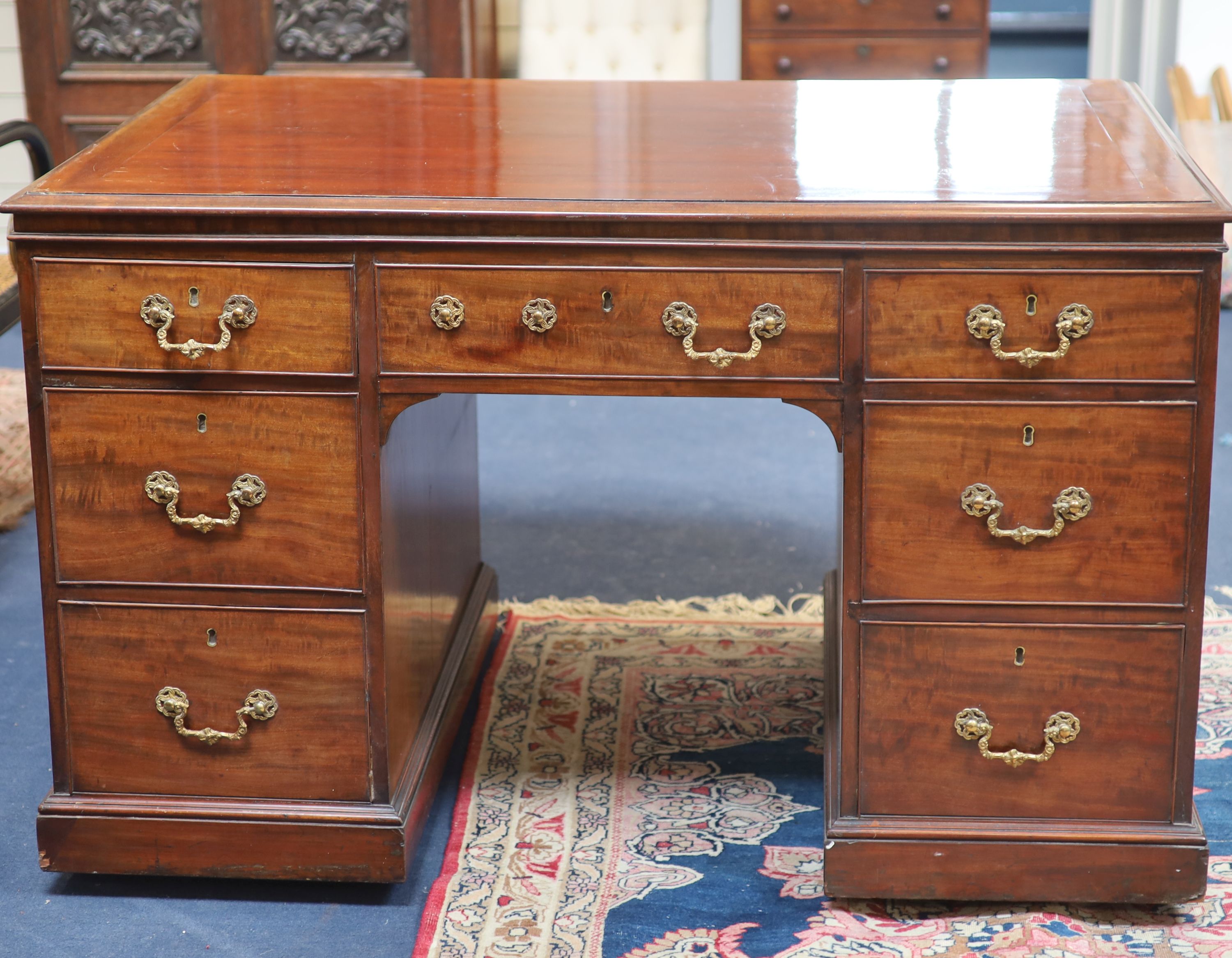 A George IV mahogany kneehole desk by William Williamson & Son of Guildford, second quarter 19th century width 125cm depth 79cm height